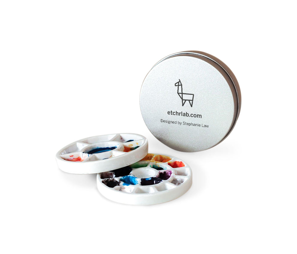 A vibrant palette and paintbrush pendant are featured on a stylish necklace, showcasing artistic flair and creativity.